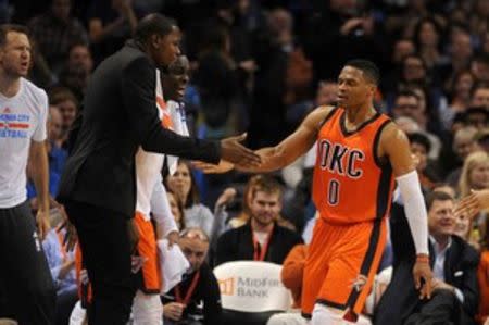 Oklahoma City Thunder forward Kevin Durant (35) congratulates Oklahoma City Thunder guard Russell Westbrook (0) after a play against the Dallas Mavericks during the second quarter at Chesapeake Energy Arena. Mandatory Credit: Mark D. Smith-USA TODAY Sports