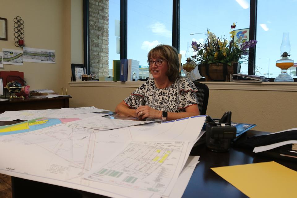 Pecos Mayor Teresa Winkles looks over files at the Pecos Economic Development Corporation, May 31, 2023 in Pecos, Texas.