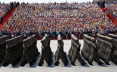 Soldiers of China's People's Liberation Army (PLA) march during the military parade to mark the 70th anniversary of the end of World War Two, in Beijing, China, September 3, 2015. REUTERS/Damir Sagolj/File Photo