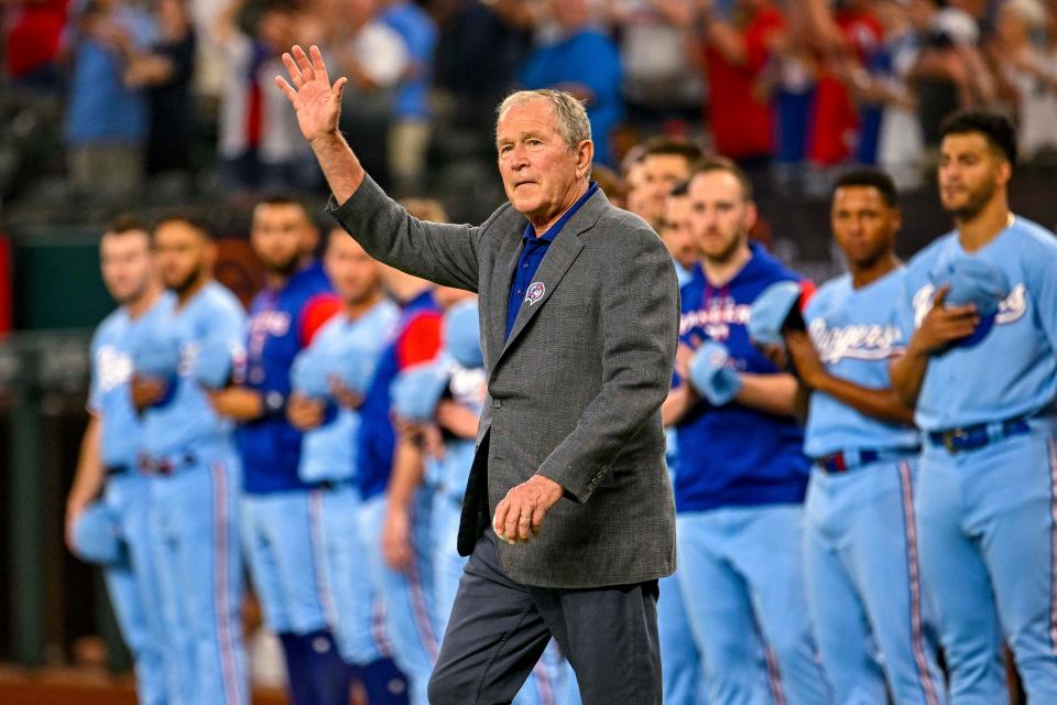 Sept. 11: Former U.S. President George W. Bush waves to the crowd before the game between the Texas Rangers and Toronto Blue Jays at Globe Life Field.