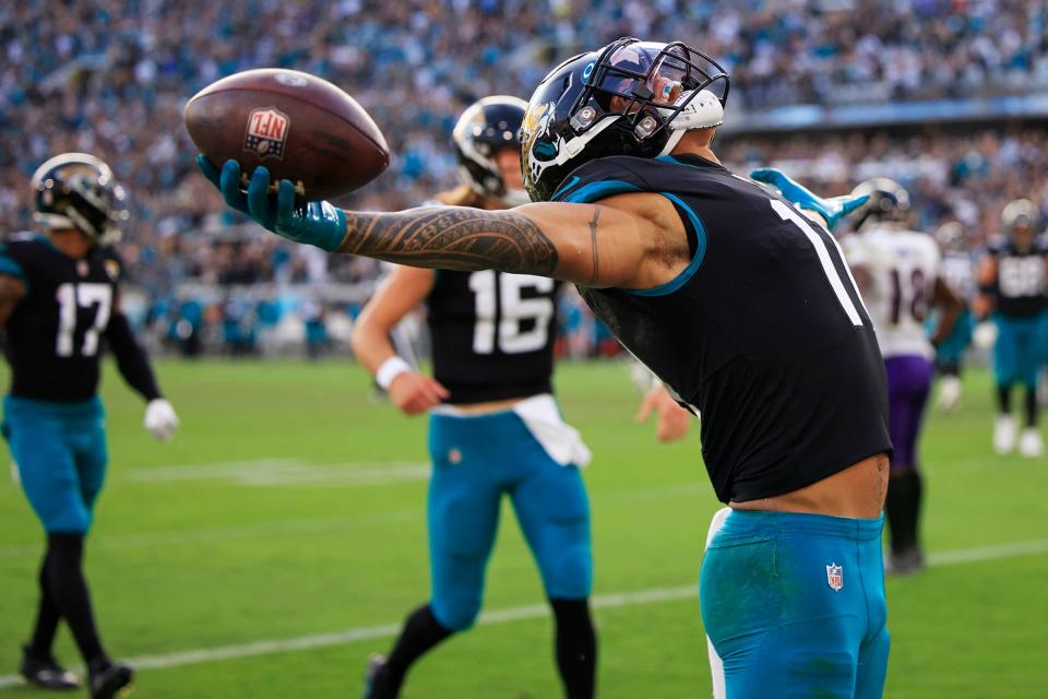 Jacksonville Jaguars wide receiver Marvin Jones Jr. (11) reacts to his touchdown pass from quarterback Trevor Lawrence (16) during the fourth quarter of a regular season NFL football matchup Sunday, Nov. 27, 2022 at TIAA Bank Field in Jacksonville. The Jaguars edged the Ravens 28-27. 