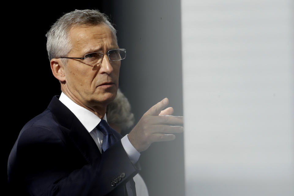 NATO Secretary General Jens Stoltenberg speaks with the media during arrivals for a NATO summit at NATO headquarters in Brussels, Monday, June 14, 2021. U.S. President Joe Biden is taking part in his first NATO summit, where the 30-nation alliance hopes to reaffirm its unity and discuss increasingly tense relations with China and Russia, as the organization pulls its troops out after 18 years in Afghanistan. (Olivier Hoslet, Pool via AP)