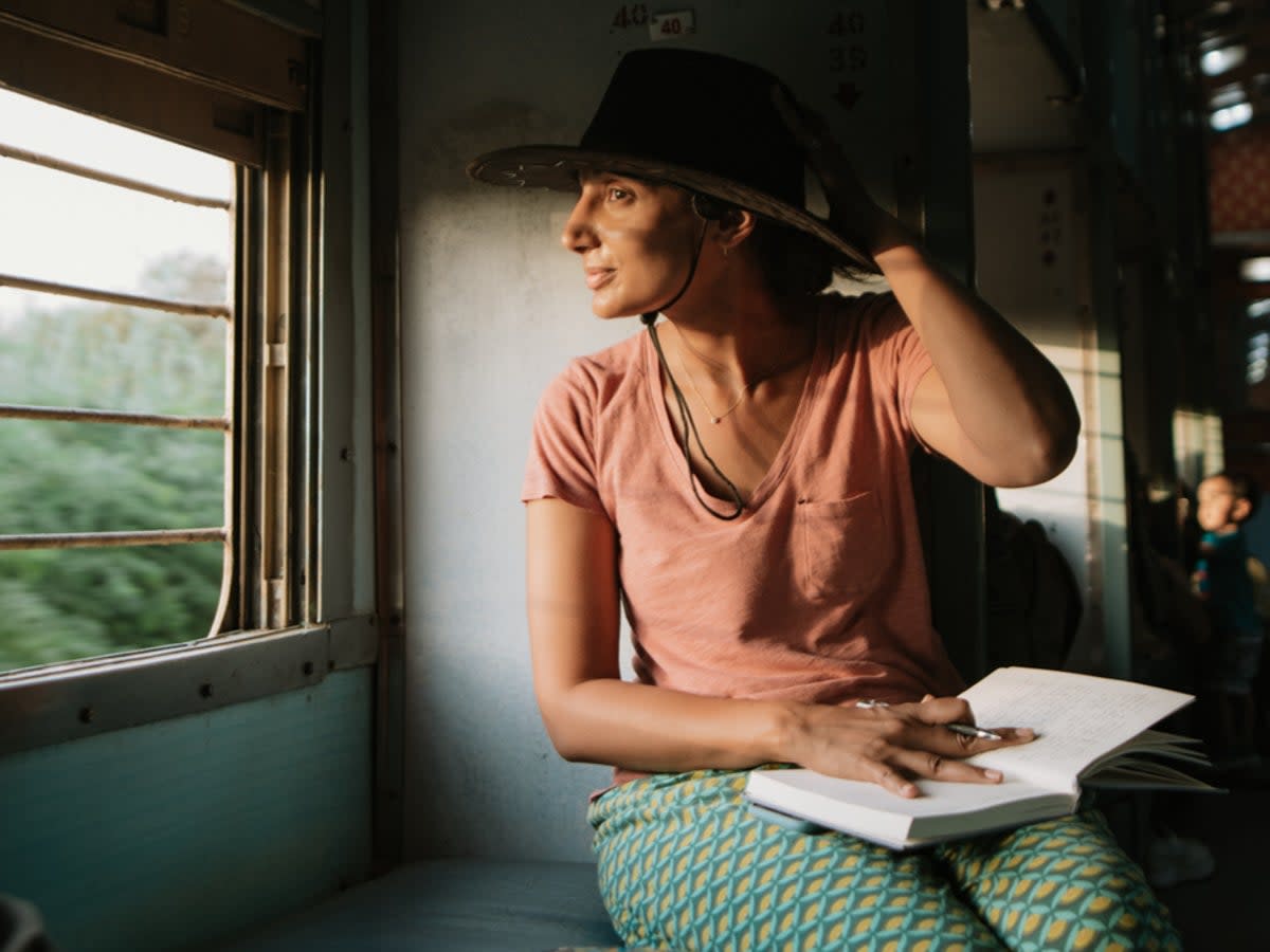 Wander woman: Monisha Rajesh on a train in India (Marc Sethi)