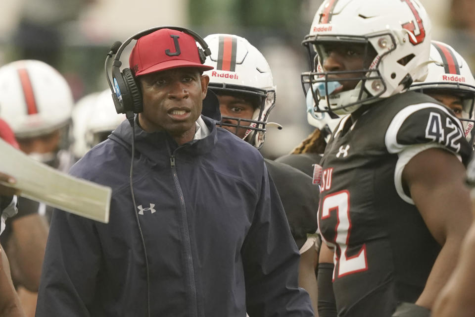 FILE - Jackson State head coach Deion Sanders glares at his players as they exit the field during the second half of an NCAA college football game against Southern University in Jackson, Miss., Saturday, Oct. 29, 2022. With less government funding and fewer resources than Power Five schools, historically Black schools have a harder time recruiting top athletes. NIL, with little uniformity in how it is enforced across states, schools and regions, has widened that gap. (AP Photo/Rogelio V. Solis, File)