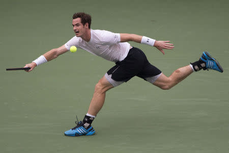 Andy Murray of Britain runs down a return to Adrian Mannarino of France during their second round match at the U.S. Open Championships tennis tournament in New York, September 3, 2015. REUTERS/Adrees Latif