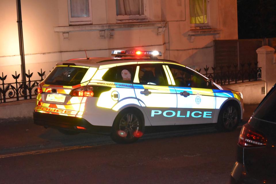 Sussex Police Car photographed at night in Hove, United Kingdom.