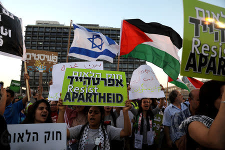 Israeli Arabs and their supporters take part in a rally to protest against Jewish nation-state law in Rabin square in Tel Aviv, Israel August 11, 2018. REUTERS/Ammar Awad