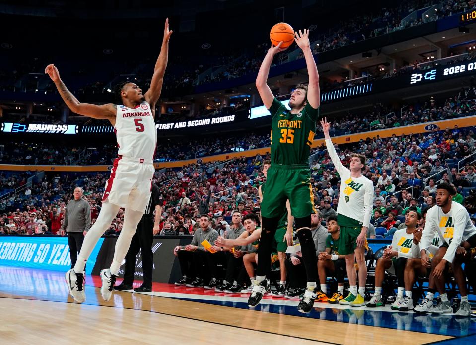 Mar 17, 2022; Buffalo, NY, USA; Vermont Catamounts forward Ryan Davis (35) shoots over Arkansas Razorbacks guard Au'Diese Toney (5) in the second half during the first round of the 2022 NCAA Tournament at KeyBank Center. Mandatory Credit: Gregory Fisher-USA TODAY Sports