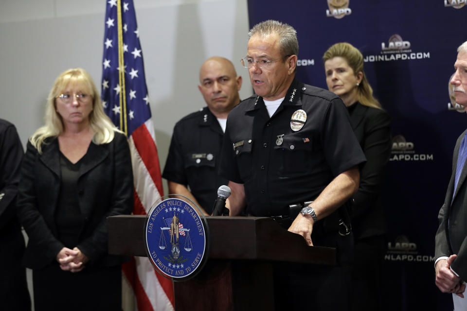 Los Angeles Police Department Chief Michel Moore informs the media on developments on the killing of off-duty Los Angeles police officer Juan Diaz at LAPD headquarters Tuesday, Aug. 6, 2019, in Los Angeles. Authorities say the fatal shooting of the off-duty Los Angeles police officer occurred during a two-hour series of crimes by gang members that included another attempted shooting where the targets were unhurt. Prosecutors on Tuesday filed multiple charges against the three suspects arrested last week in the killing of Officer Diaz. (AP Photo/Marcio Jose Sanchez)