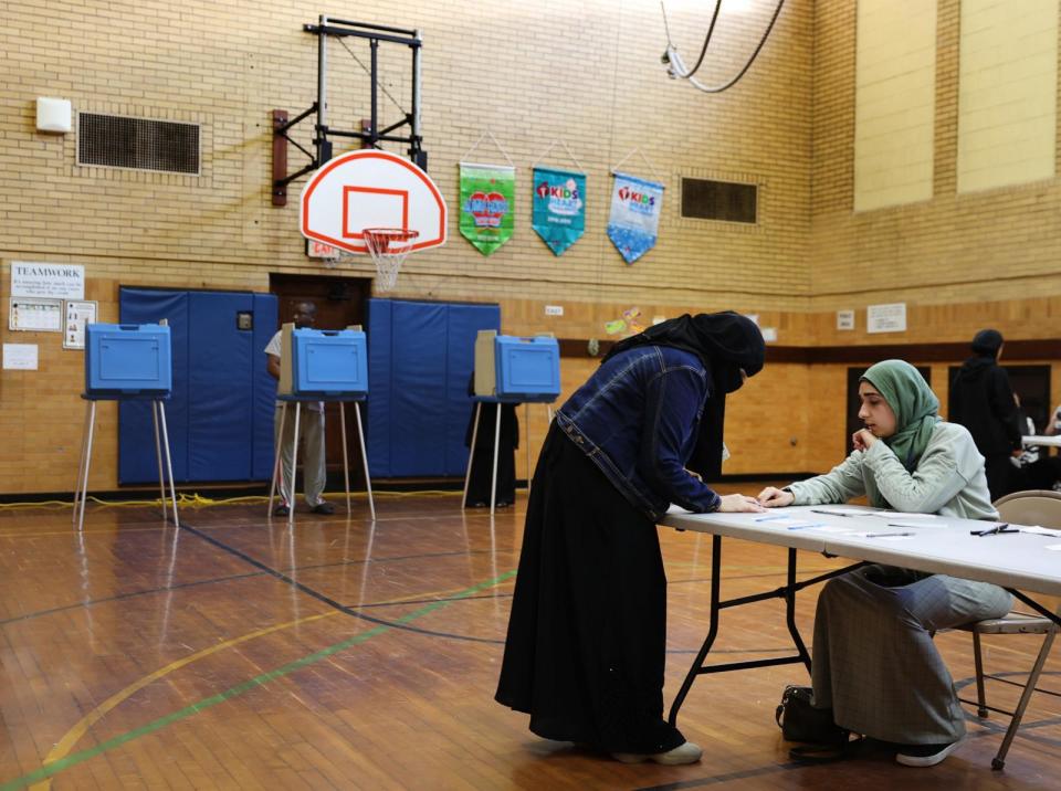 PHOTO: A voter checks-in to cast their ballot in the Michigan primary election at McDonald Elementary School, Feb. 27, 2024, in Dearborn, Mich. (Kevin Dietsch/Getty Images)