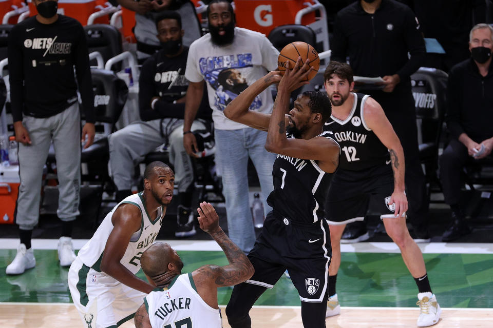 Kevin Durant shoots over P.J. Tucker.