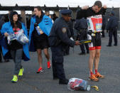 NYPD officers check runners as they arrive to compete in the 2016 New York City Marathon in the Manhattan borough of New York City, U.S., November 6, 2016. REUTERS/Brendan McDermid