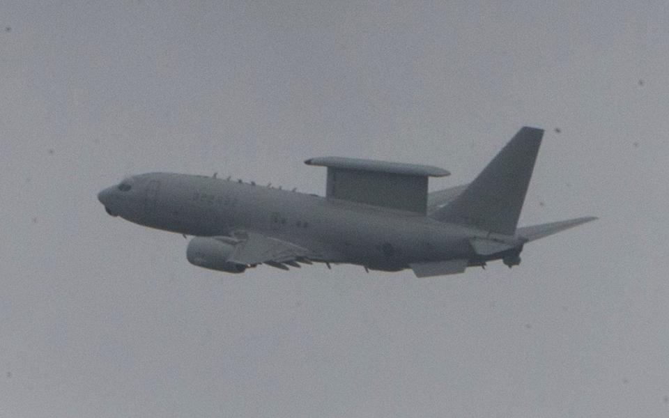 An AWACS air surveillance plane lifts off from a runway in the southeastern port of Busan, South Korea - Credit: EPA