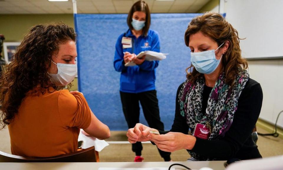 Healthcare workers take part in a rehearsal for the administration of the Pfizer coronavirus vaccine at Indiana University Health in Indianapolis, 11 December.