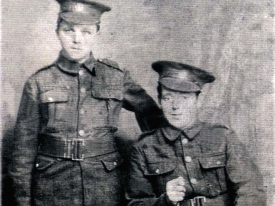 Pte. John Lambert, left, and an unknown soldier, right, in an undated photo.  (Submitted by the Coady family/Government of Canada - image credit)