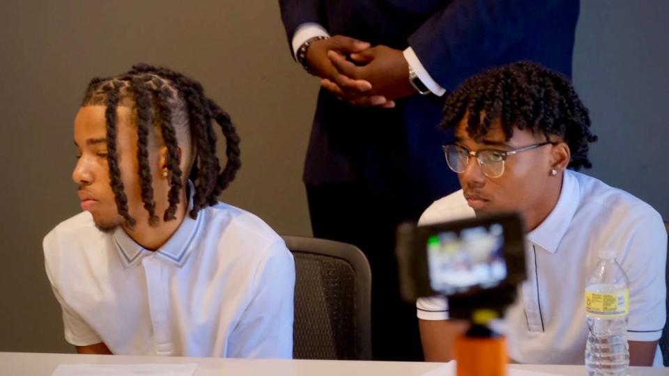 Isaiah Evens, 17, left, and 15-year-old Noah Evans appeared at a news conference with their family Tuesday. Their family said when the teens showed up at Summit Waves water park Saturday for the older brother’s birthday party, they were told the reservation had been canceled, with no reason given.