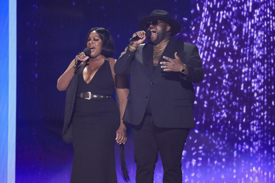 Tanya Trotter, left, and Michael Trotter Jr. of The War and Treaty introduce a performance by Kane Brown during the 59th annual Academy of Country Music Awards on Thursday, May 16, 2024, at the Ford Center in Frisco, Texas. (AP Photo/Chris Pizzello)