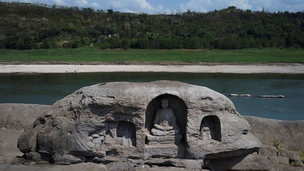 PHOTO: A once submerged Buddhist statue sits on top of Foyeliang island reef in the Yangtze river, which appeared after water levels fell due to a regional drought in Chongqing, China, August 20, 2022. (Thomas Peter/Reuters)