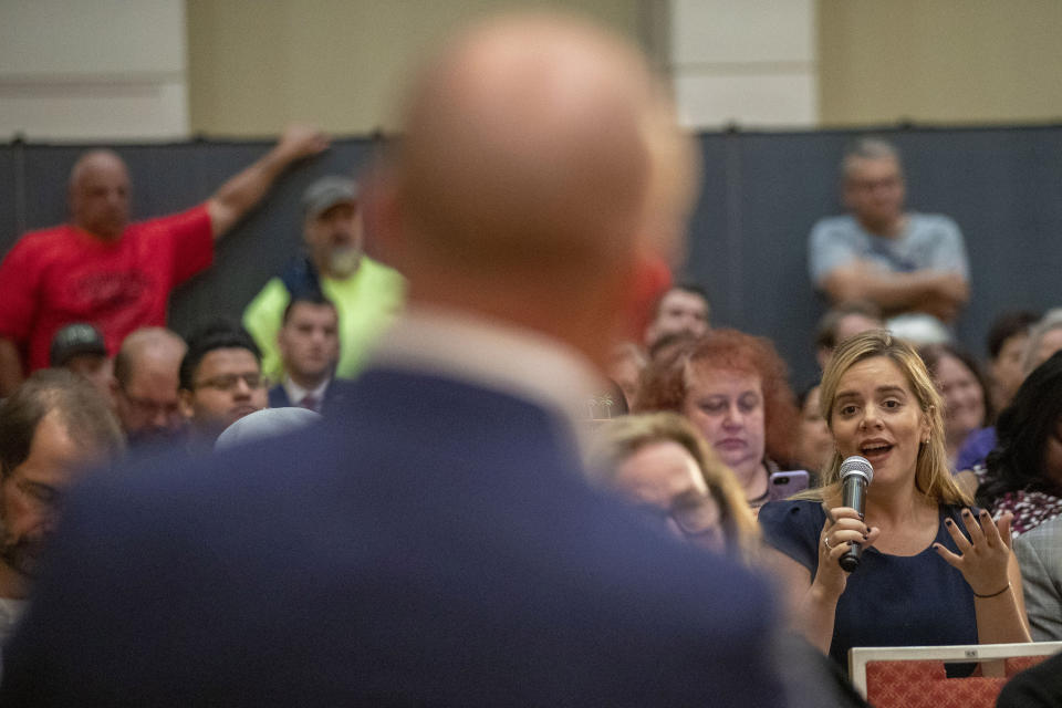 U.S. Rep. Max Rose takes a question from a constituent during a town hall meeting, Wednesday, Oct. 2, 2019, at the Joan and Alan Bernikow Jewish Community Center in the Staten Island borough of New York. (AP Photo/Mary Altaffer)