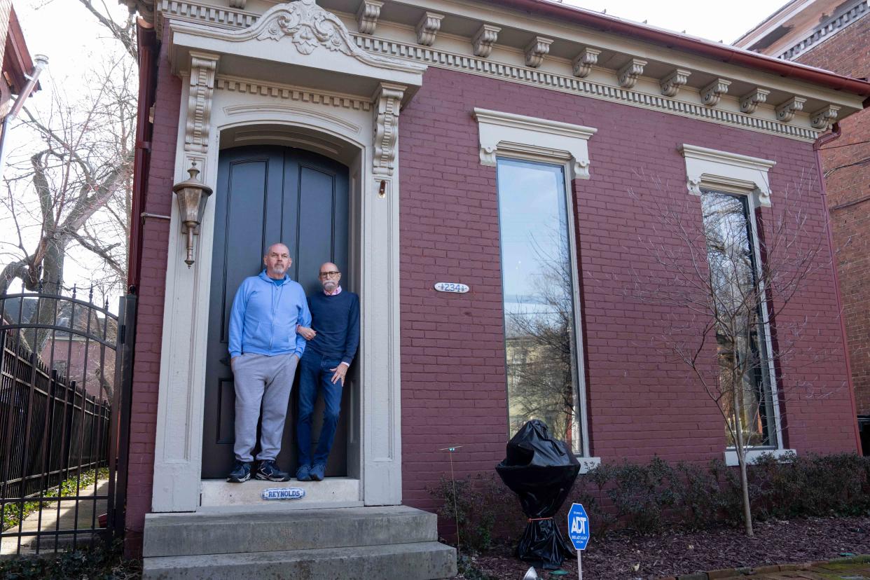 Bill and Mark Reynolds stand in front of their house on Oak Street on Monday, Feb. 12, 2024.