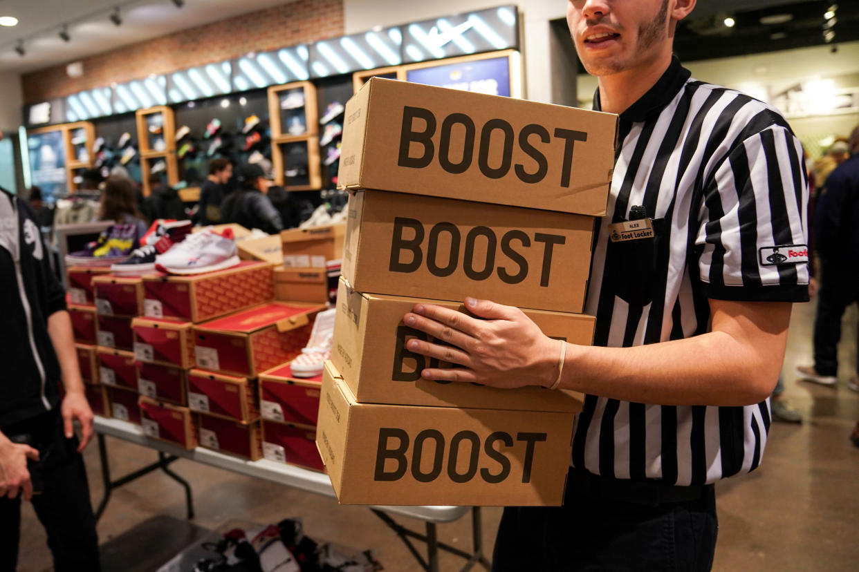 A Foot Locker employee retrieves boxes of Kanye West's Yeezy shoes in King of Prussia mall on Black Friday, a day that kicks off the holiday shopping season, in King of Prussia, Pennsylvania, U.S., on November 29, 2019. REUTERS/Sarah Silbiger