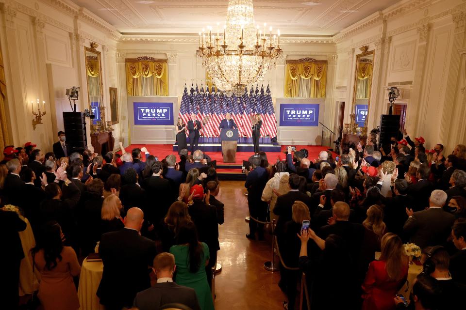 Trump speaks on election night in a packed White House East Room, where few guests wore masks.  (Chip Somodevilla via Getty Images)