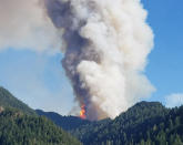 <p>The Eagle Creek wildfire burns in the Columbia River Gorge east of Portland, Ore. A lengthy stretch of highway Interstate 84 remains closed Sept. 5, 2017, as crews battle the growing Eagle Creek wildfire that has also caused evacuations and sparked blazes across the Columbia River in Washington state. (Photo: Inciweb via AP) </p>