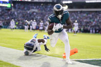 Philadelphia Eagles' A.J. Brown scores a touchdown in front of Tennessee Titans' Kristian Fulton during the first half of an NFL football game, Sunday, Dec. 4, 2022, in Philadelphia. (AP Photo/Matt Rourke)