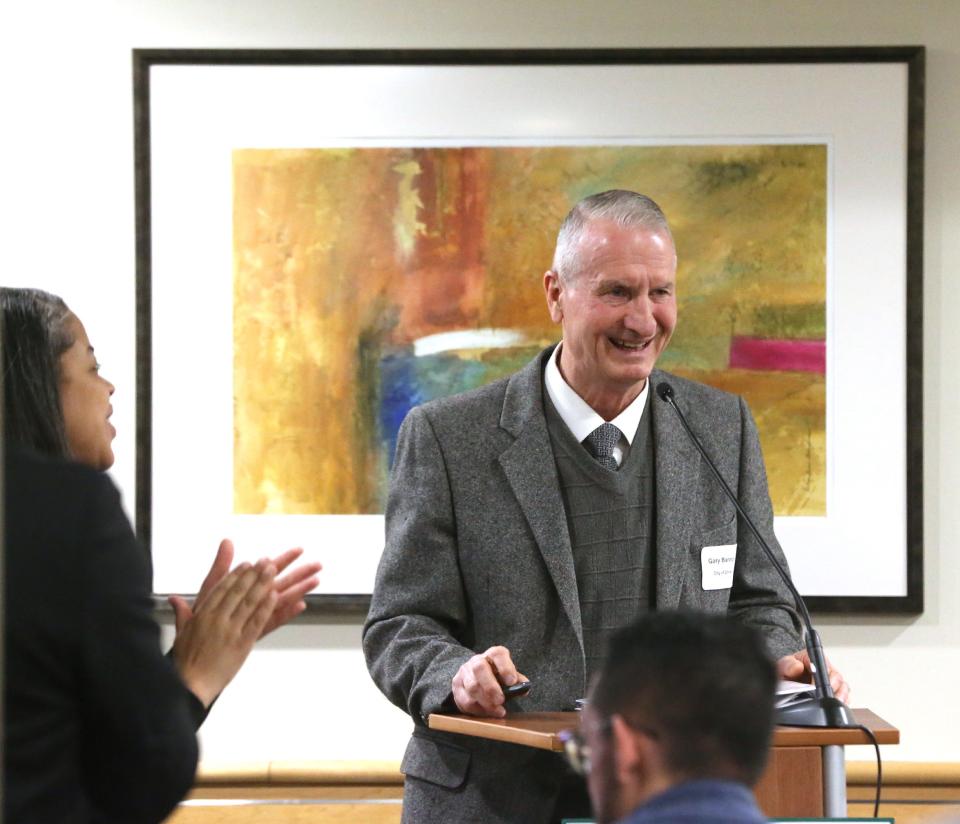 A standing ovation is given to retiring Dover recreation director Gary Bannon during the Greater Dover Chamber of Commerce's State of the City event Thursday, March 28, 2024.