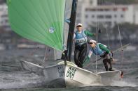 FILE - Brazil's Kahena Kunze, right, and Martine Grael compete during the 49er FX women medal race at the 2016 Summer Olympics in Rio de Janeiro, Brazil, Thursday, Aug. 18, 2016. Brazil won the gold medal. (AP Photo/Bernat Armangue, File)