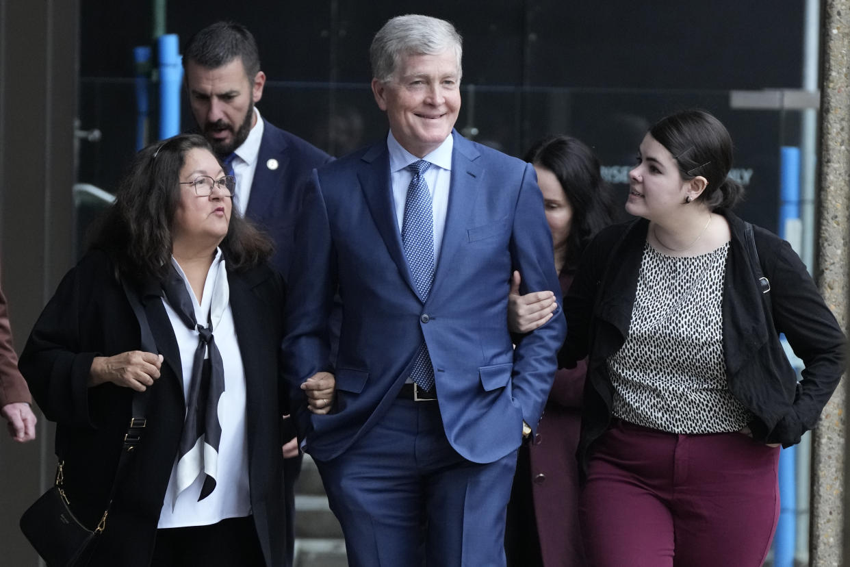 Steve Johnson, center, the brother of Scott Johnson, walks with his wife Rosemarie, left, and daughter Tessa outside the New South Wales Supreme Court in Sydney, Thursday, June 8, 2023. (AP Photo/Rick Rycroft)