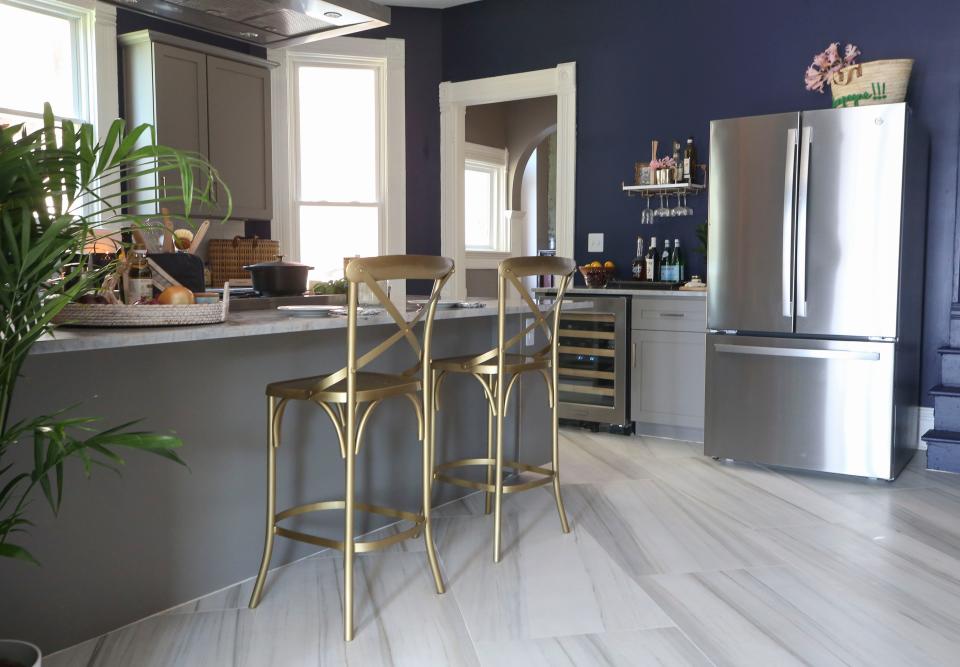 The tiles in the Beechmont Victorian kitchen Dana McMahan designed are a two-foot by four-foot format from Florida Tile (manufactured in Lawrenceburg, Kentucky), set on an angle. The size and placement give the kitchen a fresh, contemporary look and help make it feel more spacious.