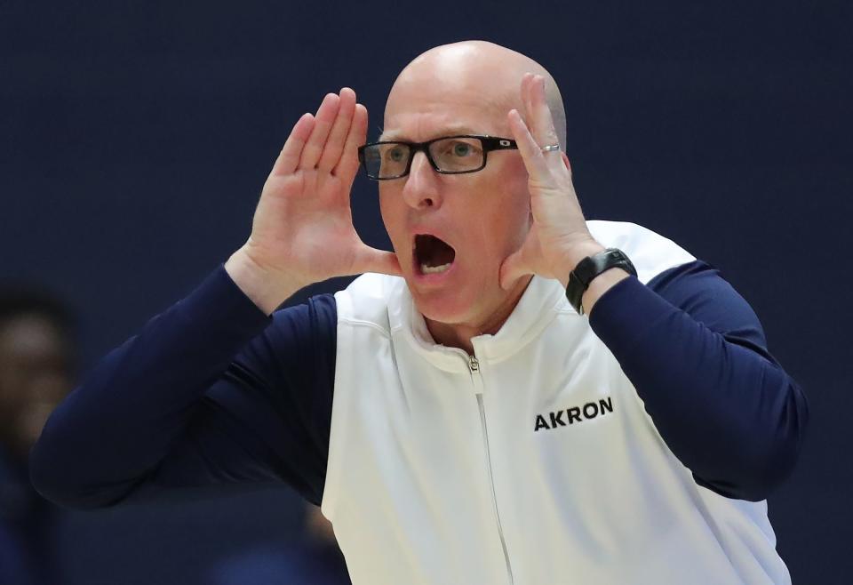 Akron coach John Groce calls plays from the sideline during a Jan. 5 game in Akron.