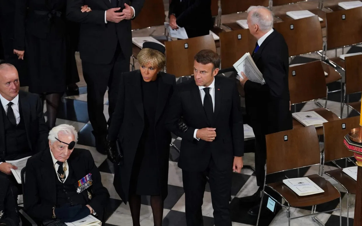 French President Emmanuel Macron and his wife Brigitte Macron arrive at Westminster Abbey for Queen Elizabeth II's funeral - GARETH FULLER /AFP via Getty Images