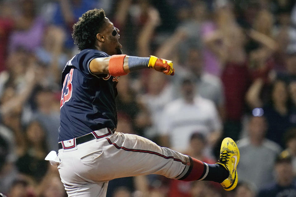 Atlanta Braves' Ronald Acuna Jr. celebrates after scoring on a two RBI single by Austin Riley during the 11th inning of a baseball game against the Boston Red Sox, Tuesday, Aug. 9, 2022, in Boston. (AP Photo/Charles Krupa)