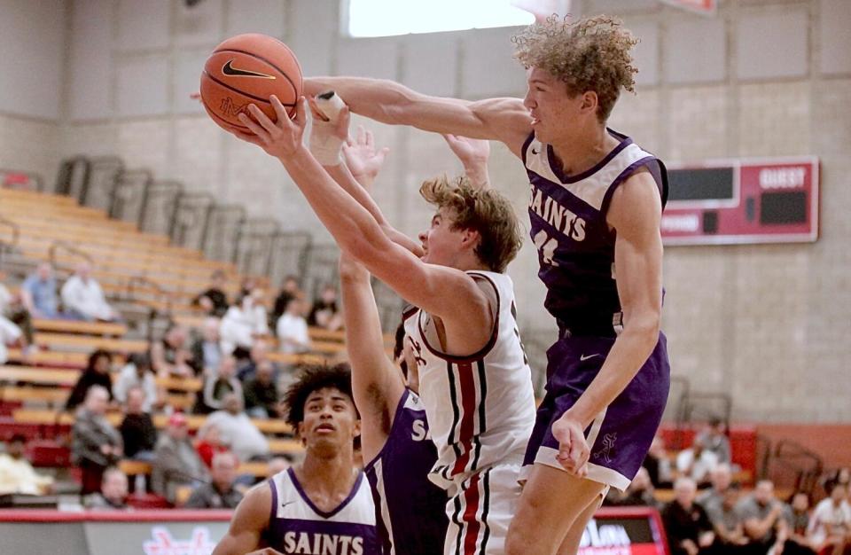 JSerra forward Korin Hull's shot is blocked from behind by St. Augustine's Isaiah Hasten during the Nike Extravaganza.