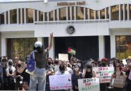 Pro-Palestinian protesters cheer while listening to speaker Maryam Imam during a demonstration in support of Palestine at the University of Central Florida, in Orlando, Fla., Friday, April 26, 2024. A crowd estimated at about 200 rallied and marched on campus in opposition to Israel's response in the armed conflict between Israel and Hamas-led Palestinian militant groups. (Joe Burbank/Orlando Sentinel via AP)