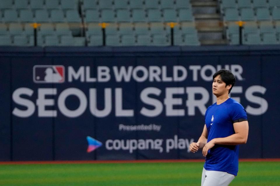 Dodgers' Shohei Ohtani attends a baseball workout at the Gocheok Sky Dome in Seoul, South Korea.