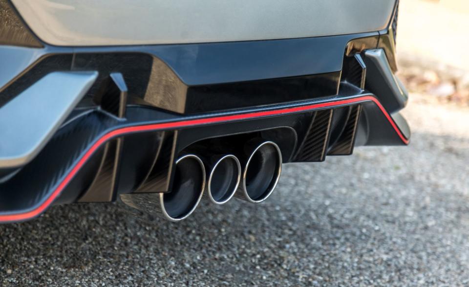 <p>Honda's triple-outlet passive exhaust turns up the volume under load, but at any pace, the Type R's soundtrack is a one-note drone that lacks the fireworks of the N's exhaust.</p>