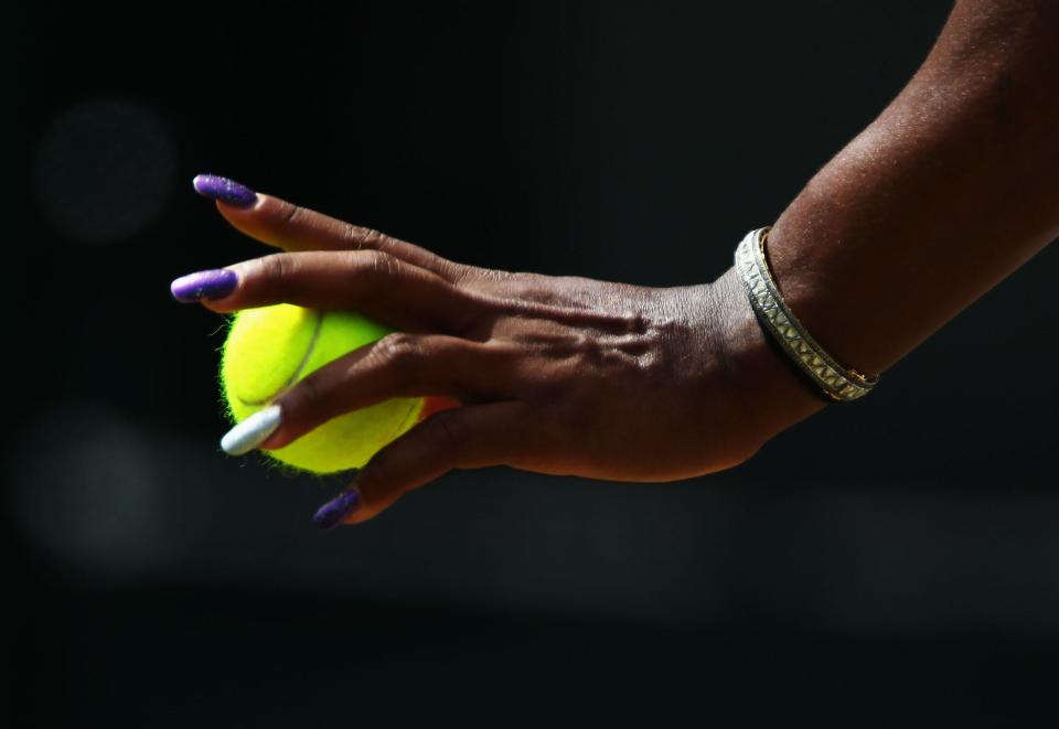 Serena Williams prepares to serve the ball during her fourth-round match at Wimbledon in 2011.