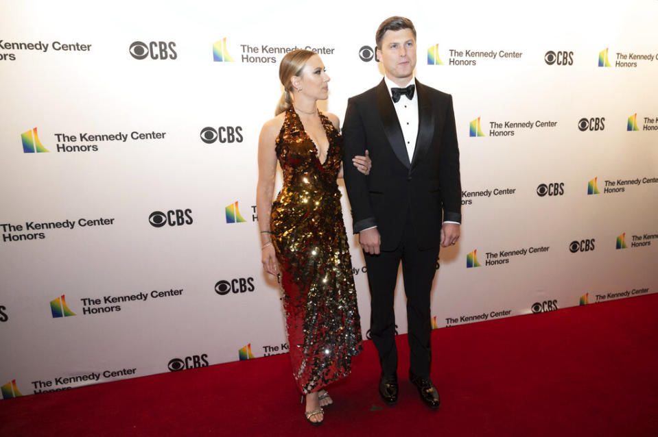 Saturday Night Live member Colin Jost, right, and Scarlett Johansson pose on the red carpet at the 44th Annual Kennedy Center Honors. - Credit: (AP Photo/Kevin Wolf)