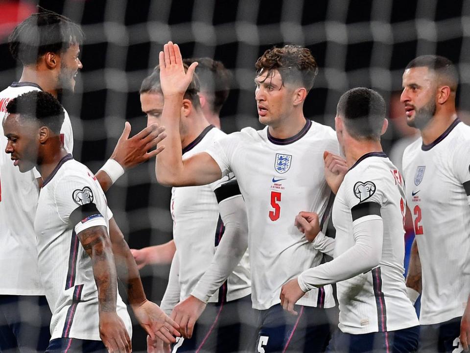 England players celebrate John Stones’ (centre) equaliser (AFP via Getty Images)