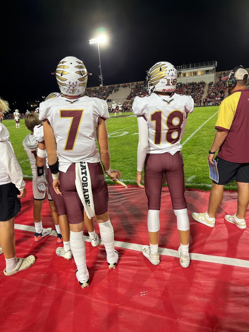 Dunlap quarterbacks Mack Sutter (7) and John Bargen (18) stand on the sidelines during a Sept. 8, 2023, football game against Pekin.