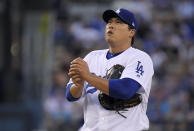 Los Angeles Dodgers starting pitcher Hyun-Jin Ryu rubs up the ball before pitching during the first inning of the team's baseball game against the San Francisco Giants on Wednesday, Aug. 15, 2018, in Los Angeles. (AP Photo/Mark J. Terrill)