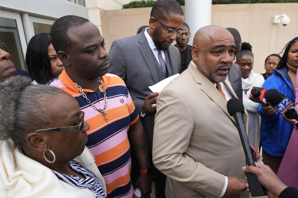 Civil co-counsel Trent Walker, right, speaks to reporters on the sentencing of the third former Rankin County law enforcement officer, while his one of his clients, Eddie Terrell Parker, left, and his aunt, Linda Rawls listen, while outside the federal courthouse in Jackson, Miss., Wednesday, March 20, 2024. Former Rankin County deputy Daniel Opdyke was sentenced to 17.5 years in federal prison for his role with five other now former Rankin County law enforcement officers, in the racially motivated, violent torture of Parker and Jenkins. (AP Photo/Rogelio V. Solis)