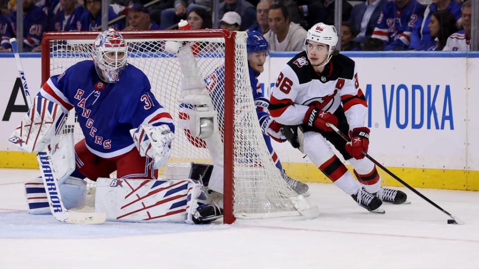 Apr 24, 2023; New York, New York, USA; New Jersey Devils center Jack Hughes (86) controls the puck against New York Rangers goaltender Igor Shesterkin (31) and defenseman Adam Fox (23) during the second period in game four of the first round of the 2023 Stanley Cup Playoffs at Madison Square Garden.