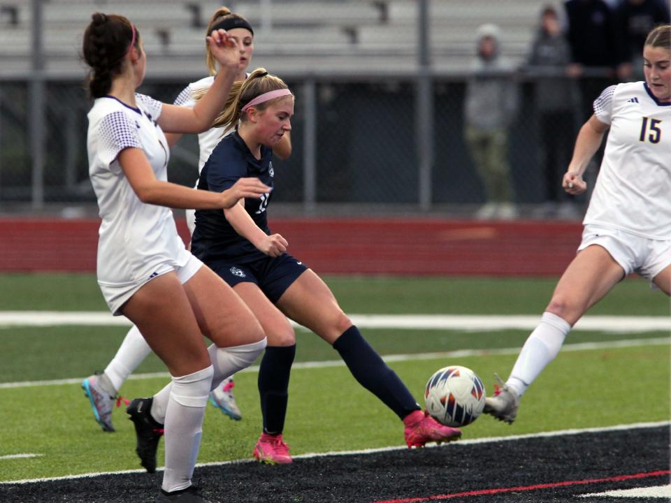 Granville's Ivy Miller attempts a shot on goal between Bloom-Carroll defenders on Saturday.