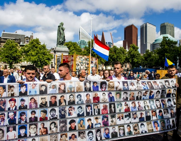 Demonstrators take part in a peace march in remembrance of the victims of the 1995 Srebrenica massacre in The Hague on July 11, 2016