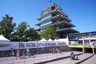 Fans walk into the infield before the start of qualifications for the Indianapolis 500 auto race at Indianapolis Motor Speedway in Indianapolis, Sunday, May 19, 2024. (AP Photo/Michael Conroy)