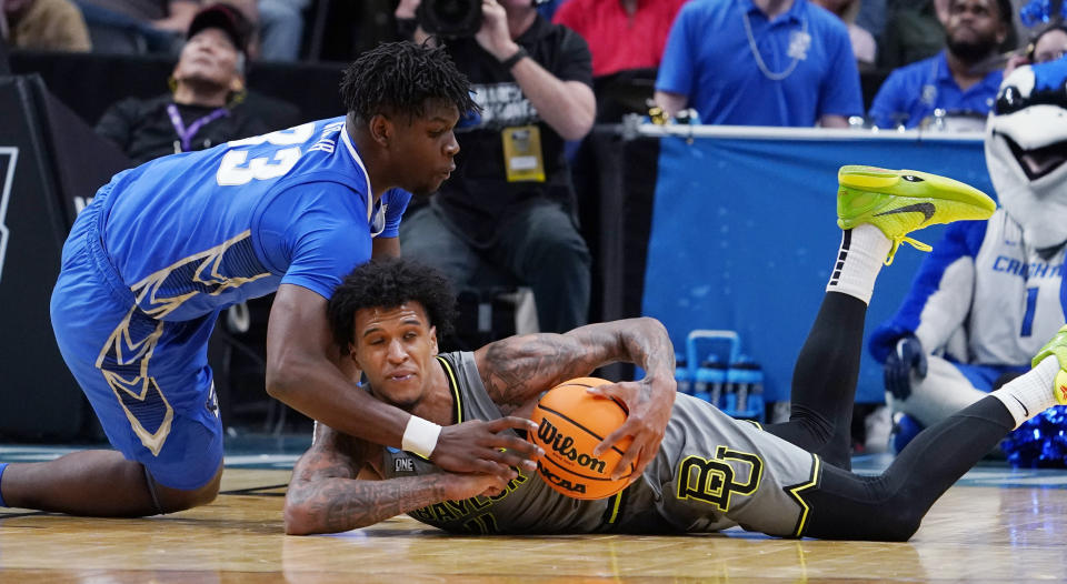 Baylor forward Jalen Bridges tries to keep the ball from Creighton center Fredrick King, left, during the second half of a second-round college basketball game in the men's NCAA Tournament on Sunday, March 19, 2023, in Denver. (AP Photo/John Leyba)